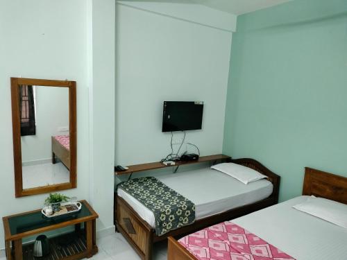 Cama o camas de una habitación en Teja Residency
