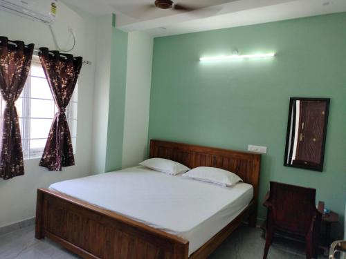 Cama o camas de una habitación en Teja Residency