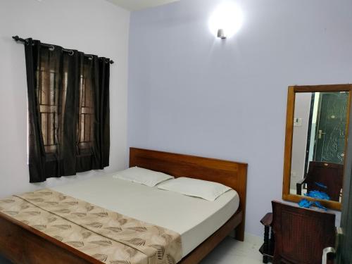 Cama o camas de una habitación en Teja Residency