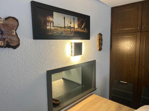 a living room with a flat screen tv on a wall at Ferienwohnung Truckses Schluchsee in Schluchsee
