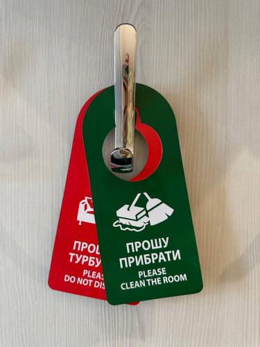 a green and red object with a tag with a car on it at Voyage in Odesa