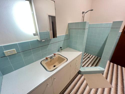 a bathroom with a sink and a mirror at 33 Room in Epping