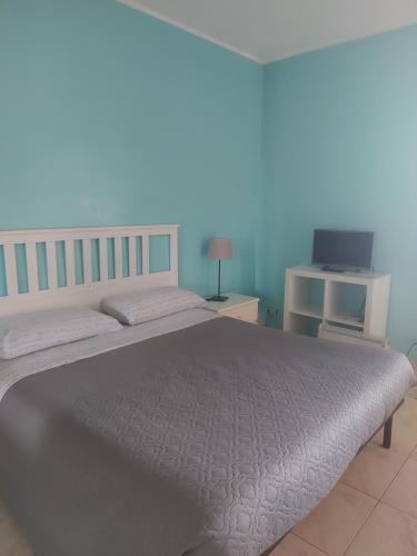 Ένα ή περισσότερα κρεβάτια σε δωμάτιο στο Le Ninfe Bed and Breakfast
