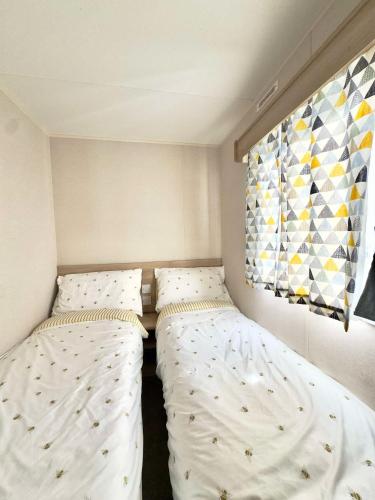 Postel nebo postele na pokoji v ubytování Haven Caravan