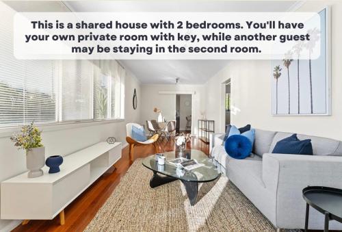 a living room with a couch and a table at Oakleigh Haven in Oakleigh East