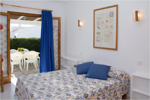 En eller flere senge i et værelse på Villa Marta