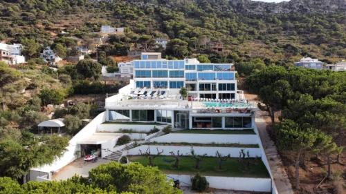 an aerial view of a large blue building at Exceptional Luxury Villa A Masterpiece of Elegance and Comfort in Rafrāf