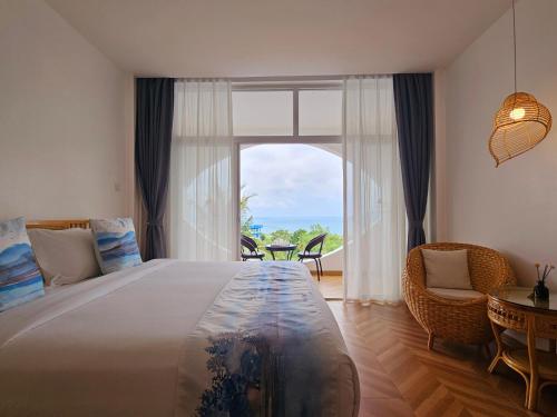 Krevet ili kreveti u jedinici u okviru objekta Puerto Galera Seaview Resort