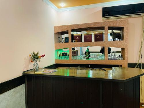 a kitchen with a counter with a sink and a mirror at Aero Hotel Tour Armenia in Pʼarakʼar
