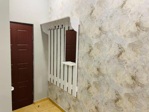 a mirror on a wall with a marble wall at Aero Hotel Tour Armenia in Pʼarakʼar