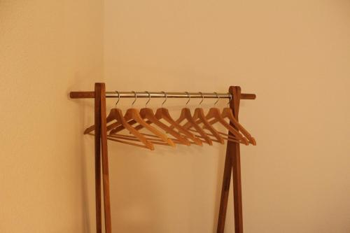 a wooden rack in the corner of a room at Ruhiges, schönes Studio in Zuchwil in Zuchwil