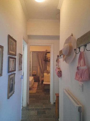 a hallway with a living room and a room with a room at Cozy Christina in Skala Oropou