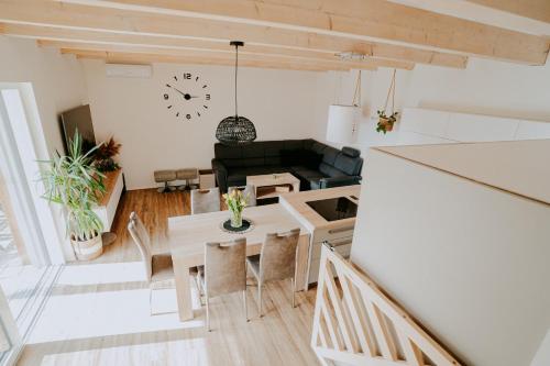 a living room with a table and a couch at Ubytování Ve dvorku in Uherčice