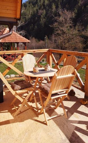two chairs and a table on a patio at Dedin Konak in Mokra Gora