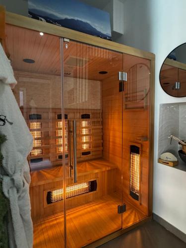 a shower with a glass door in a bathroom at Scugnizzo Apartment in Naples