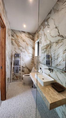 a bathroom with a sink and a toilet at Sunterra villa in Nathon Bay