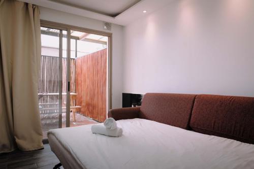Giường trong phòng chung tại Rich Apartments