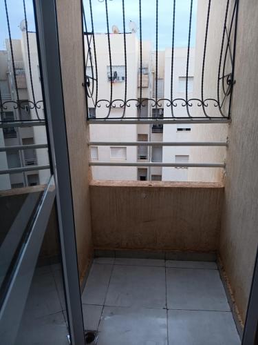 a balcony with a view of a building at Appartement neuf équipé à Fez in Fès