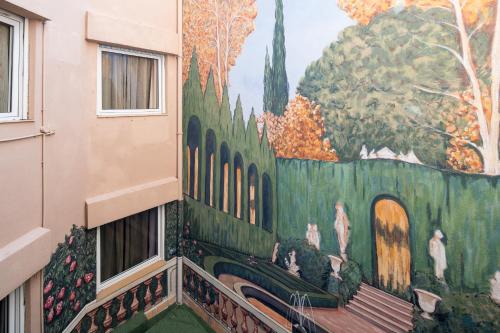 a mural on the side of a building at Catalonia Park Putxet in Barcelona