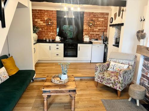 Kuchyň nebo kuchyňský kout v ubytování Kolly Cottage