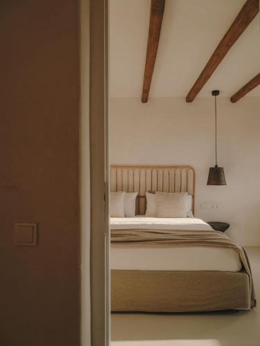a bedroom with a bed in a room at The Wild by Interni in Kalafatis