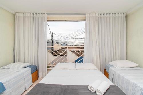 Postel nebo postele na pokoji v ubytování Quarto em casa compartilhada 5 min da Esplanada