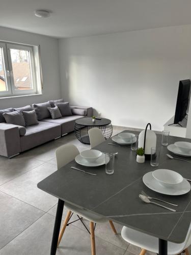 a living room with a table and a couch at Ferienwohnung Messewohnung in Cologne