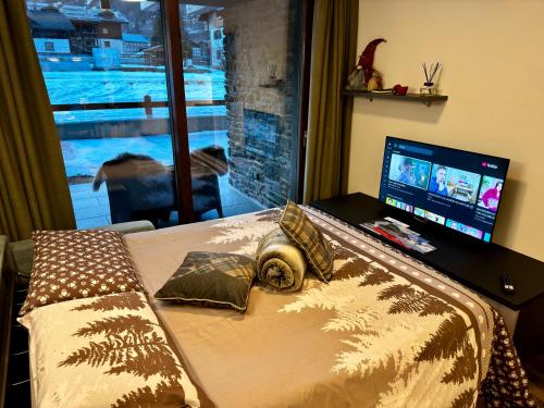 TV a/nebo společenská místnost v ubytování Isolaccia angolo di paradiso