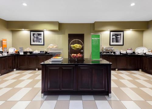 a lobby with a counter with a bowl of fruit on it at Hampton Inn & Suites Hobbs in Hobbs