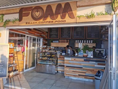 a store front of a coffee shop with a counter at OCEAN SHOREBREAK - Umdloti resort - Back up Water in Umdloti