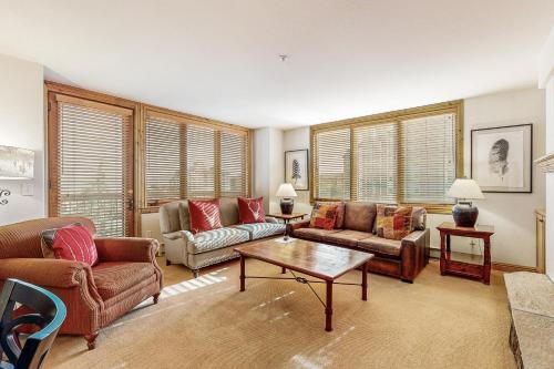 a living room with couches and a coffee table at Torian Plum Creekside 415 in Steamboat Springs