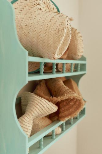 a bunch of towels are sitting on a shelf at Balili Beach House in Ferrel
