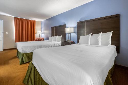 Ένα ή περισσότερα κρεβάτια σε δωμάτιο στο Dutchland Motel