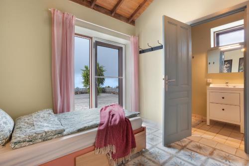 a bedroom with a bed and a window at Casa del Cielo in Adeje