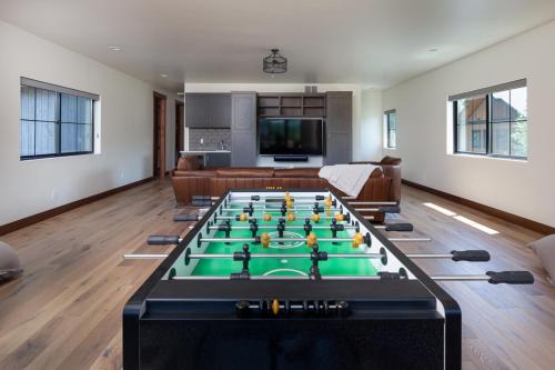 a living room with a foosball table at Lodge at Whitefish Lake in Whitefish