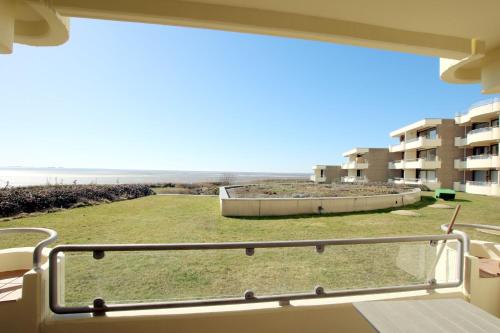 a view of the beach from the balcony of a building at Gmelinstraße 5 b, Whg C2, By de Wyk in Südstrand