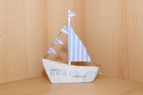 a boat shaped toy sitting on top of a table at Gmelinstraße 5 b, Whg C2, By de Wyk in Südstrand