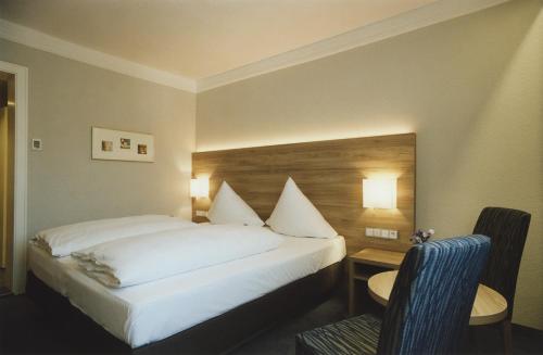 Katil atau katil-katil dalam bilik di Hotel Jedermann