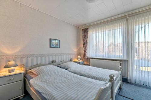 Una cama o camas en una habitación de Gästehaus Siegrid Düring