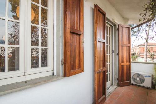 an open door of a house with a window at Holiday home Villetta Cinquale in Cinquale