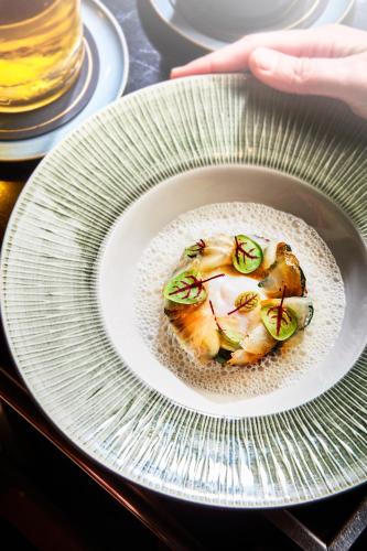a plate of food on top of a table at Domaine les Crayères in Reims