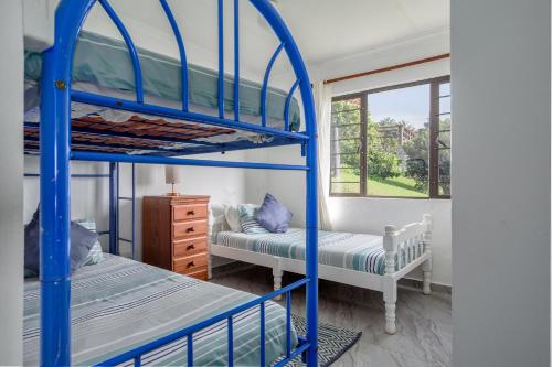 Postel nebo postele na pokoji v ubytování Barieta Beach Cottages - Self Catering