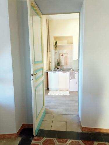 an open door leading into a kitchen with a sink at Quick Home Eco Belvedere in Graglia