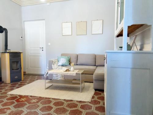 a living room with a couch and a coffee table at Quick Home Eco Belvedere in Graglia