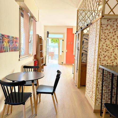 a dining room with a table and chairs at Vista Lago - Lake Como collection in Domaso