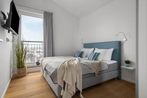 Postel nebo postele na pokoji v ubytování Ocean Sunset- Penthouse, Balkon, Kamin