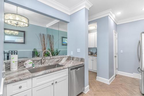 a kitchen with a sink and a counter top at Penthouse Luxury Oceanfront Condo 3 Bedrooms 3 Bathrooms Ocean Dunes Tower 1 Unit 4155 in Myrtle Beach