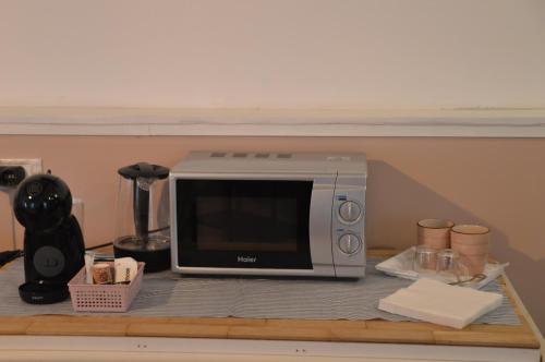 a microwave sitting on top of a counter at Dalla Fede in Loreto