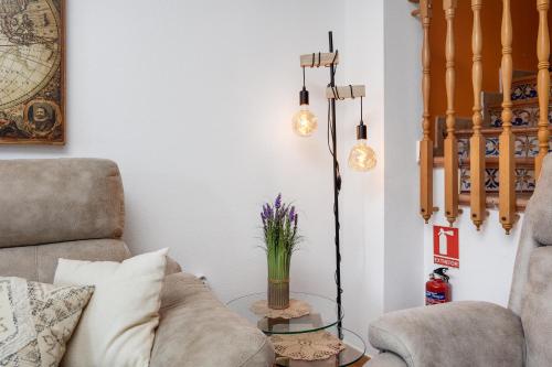 a living room with a couch and a table at CB Living - First line detached house, Cabo Roig in Orihuela