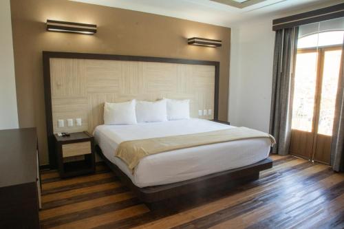 Katil atau katil-katil dalam bilik di Hotel Paseo de la Presa